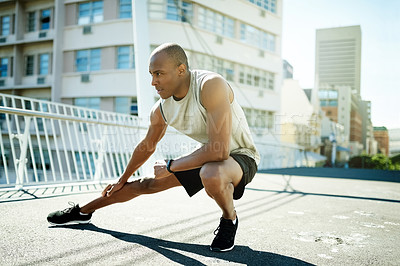 Buy stock photo Man, city and stretching legs for fitness, warm up and runner for cardio preparation. Male person, urban street and athlete for workout, getting ready and exercise for marathon training with road
