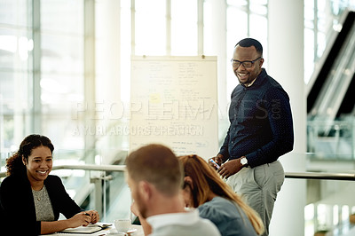 Buy stock photo Presentation, speaker and man with group, boardroom and laugh with colleagues in meeting or project. Business, sales manager and people with humor for training session, discussion and funny joke