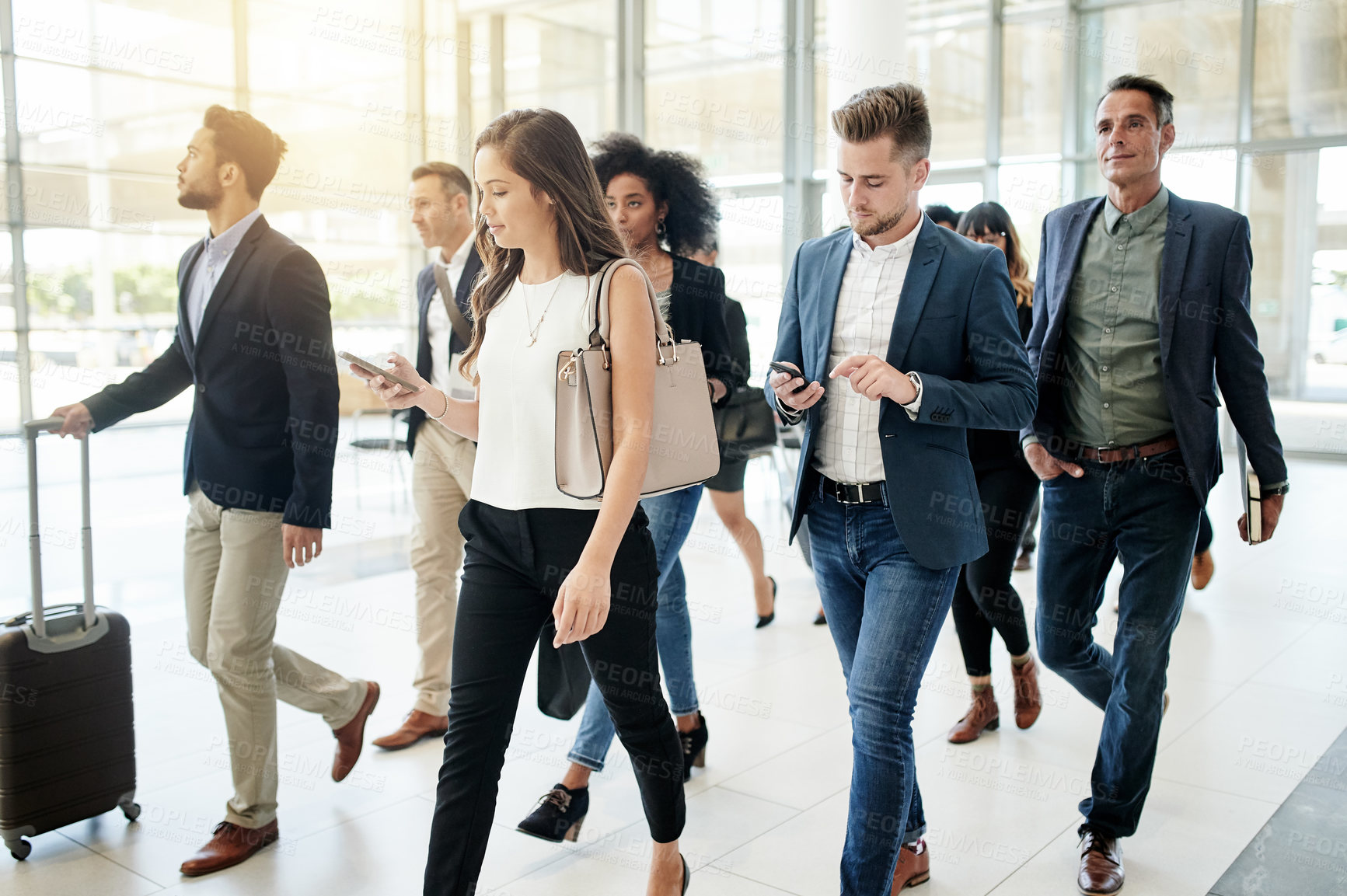 Buy stock photo Business people, walking and travel with team in corporate building for company immigration. Group, staff or employees moving together with luggage for new career, job opportunity or relocation