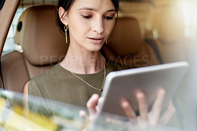 Buy stock photo Tablet, window and businesswoman in car with contact, networking or email online. Reading, digital technology and female corporate employee with communication on app in vehicle for transport.