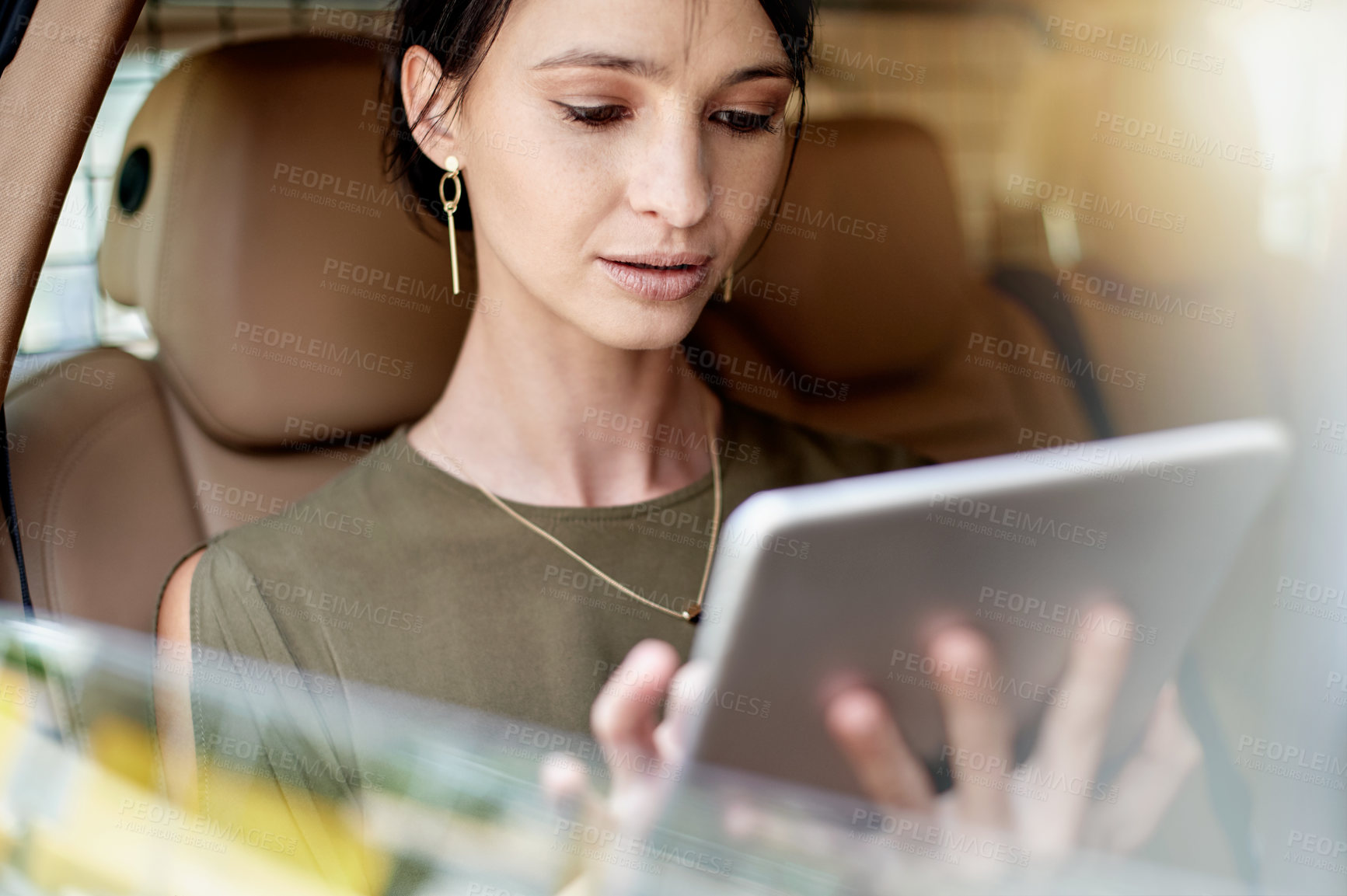 Buy stock photo Tablet, window and businesswoman in car with contact, networking or email online. Reading, digital technology and female corporate employee with communication on app in vehicle for transport.