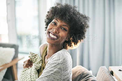 Buy stock photo Portrait, smile and black woman relax in home for weekend break, peace or calm with cushion in condo. Couch, confidence and happy African girl in living room for wellness, chill or comfort in Nigeria