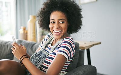 Buy stock photo Laughing, phone and thinking with woman on sofa in living room of home for reaction to meme. App, funny and social media with happy African person in apartment for comedy, communication or humor