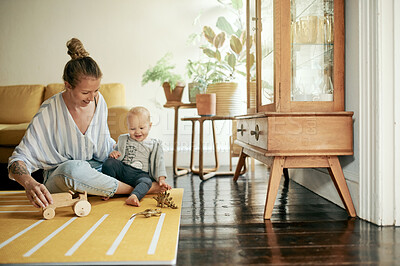 Buy stock photo Living room, play and mama and baby with toys in home for bonding, quality time and relax together. Family, love and happy mother with kid playing for child development, care and happiness on weekend