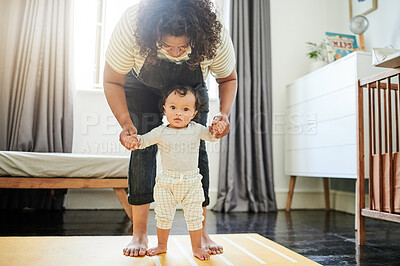 Buy stock photo Mother, baby and learning to walk holding hands in home, education and bonding. Care, development and portrait of mama teaching kid, toddler or newborn, helping and walking, support and first steps.