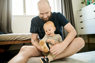 Buy stock photo Happy, morning and father with a baby and shoes to get dressed, prepare and routine in a house. Smile, playful and a dad helping a child with clothes, sneakers and applying a shoe together at home