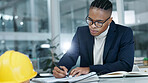 Architect, writing and black man by notes in office for building design, civil engineering or draft. Glasses, notebook and serious engineer person at workplace for planning, zoning laws and safety
