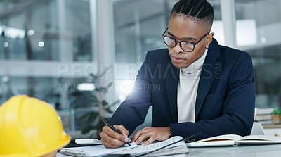 Buy stock photo Architect, writing and black man by notes in office for building design, civil engineering or draft. Glasses, notebook and serious engineer person at workplace for planning, zoning laws and safety