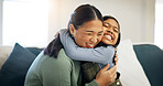 Kid, mother and hug in home with love, care and happiness for connection together with daughter. Girl, mom and embrace on sofa for trust, support or excited parent with Asian family reunion