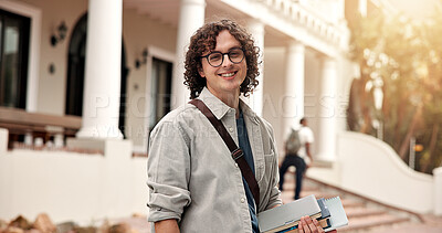 Buy stock photo Portrait, man and student at campus with smile, exchange program and scholarship for education. Happy, male person and confident at university with books, start semester and learning for knowledge