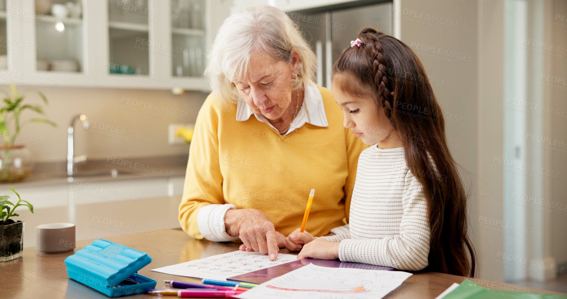 Buy stock photo Homework, grandmother and girl in kitchen with help, childcare and support with homeschool activity. Education, grandparent and kid with task aid, family guidance and assistance in home learning.