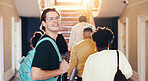 Education, student and man at college with smile to start learning, youth development or growth. University, happy person and ready for knowledge, portrait or walk with backpack for study opportunity