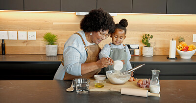 Buy stock photo Grandmother, child and baking in kitchen with flour, teaching and support with black family. Girl, grandma or pour ingredients in bowl for help with guidance, development or learning cooking at house