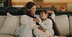 Cuddle, laugh and mom with girl on sofa for bonding, playful relationship and connection on weekend. Happy, family and mother with child for love, affection and embrace for trust, moment and relax