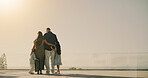 Outdoor, back and parents with children for hug, bonding or support on summer vacation with space. Married couple, kids or together at hotel for healthy family dynamic, travel holiday or balcony view