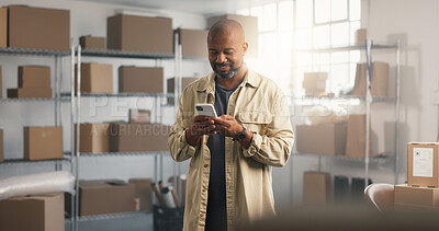 Buy stock photo Ecommerce, man and typing in office with phone, online order or smile for good review on mobile app. Happy, mature black person and package with tech, supply chain and website with customer feedback.