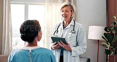 Buy stock photo Happy, doctor and woman in hospital with tablet, conversation and positive feedback for treatment. Medical worker, mature person and talk in clinic with smile, disease recovery and tech for research.