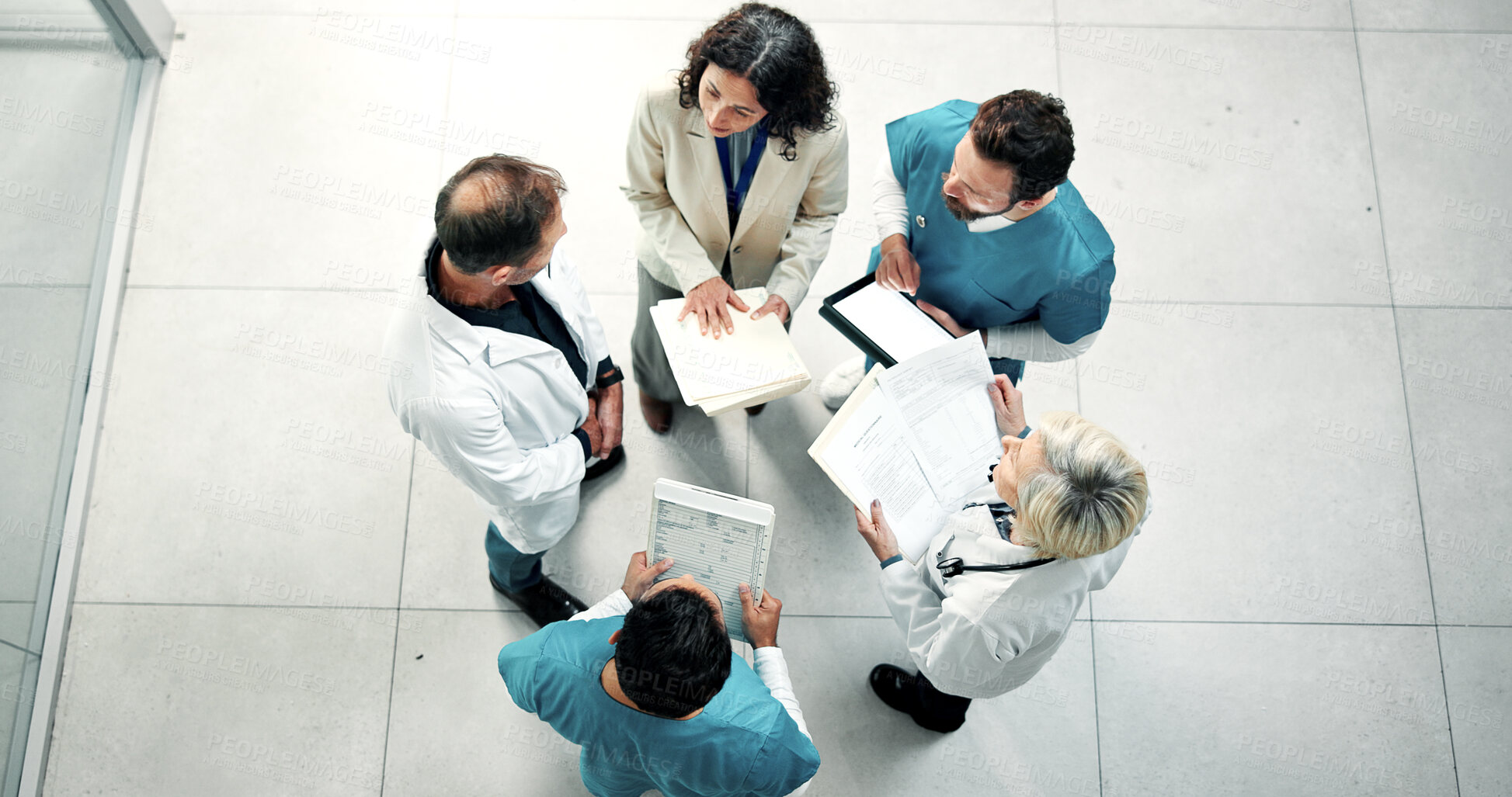Buy stock photo Documents, team and medical planning, above or clinic budget update with tablet in meeting. People, cost checklist or hospital discussion with doctors, nurses and healthcare resource evaluation