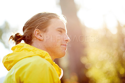 Buy stock photo Man, runner and thinking with smile in forest, profile or outdoor on break with training for fitness. Person, happy and ready for start in woods by trees for trail running, workout or exercise in USA
