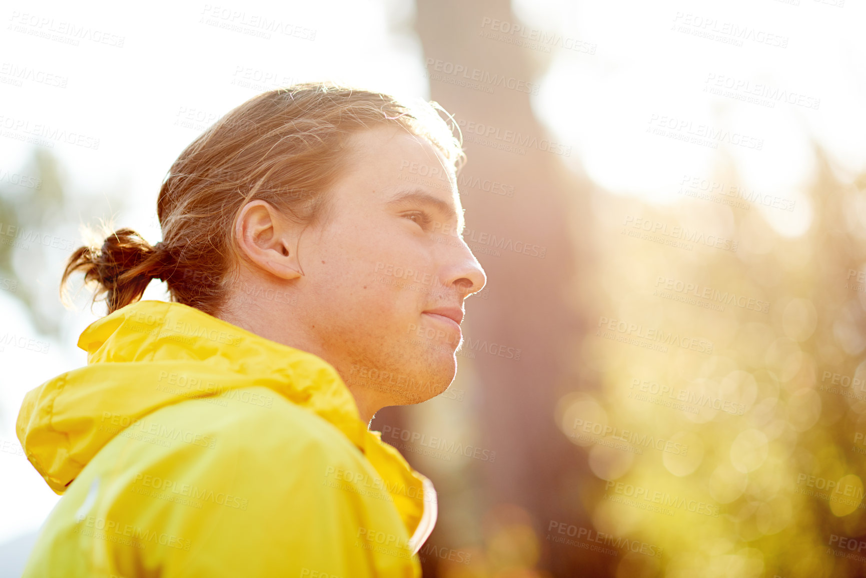 Buy stock photo Man, runner and thinking with smile in forest, profile or outdoor on break with training for fitness. Person, happy and ready for start in woods by trees for trail running, workout or exercise in USA