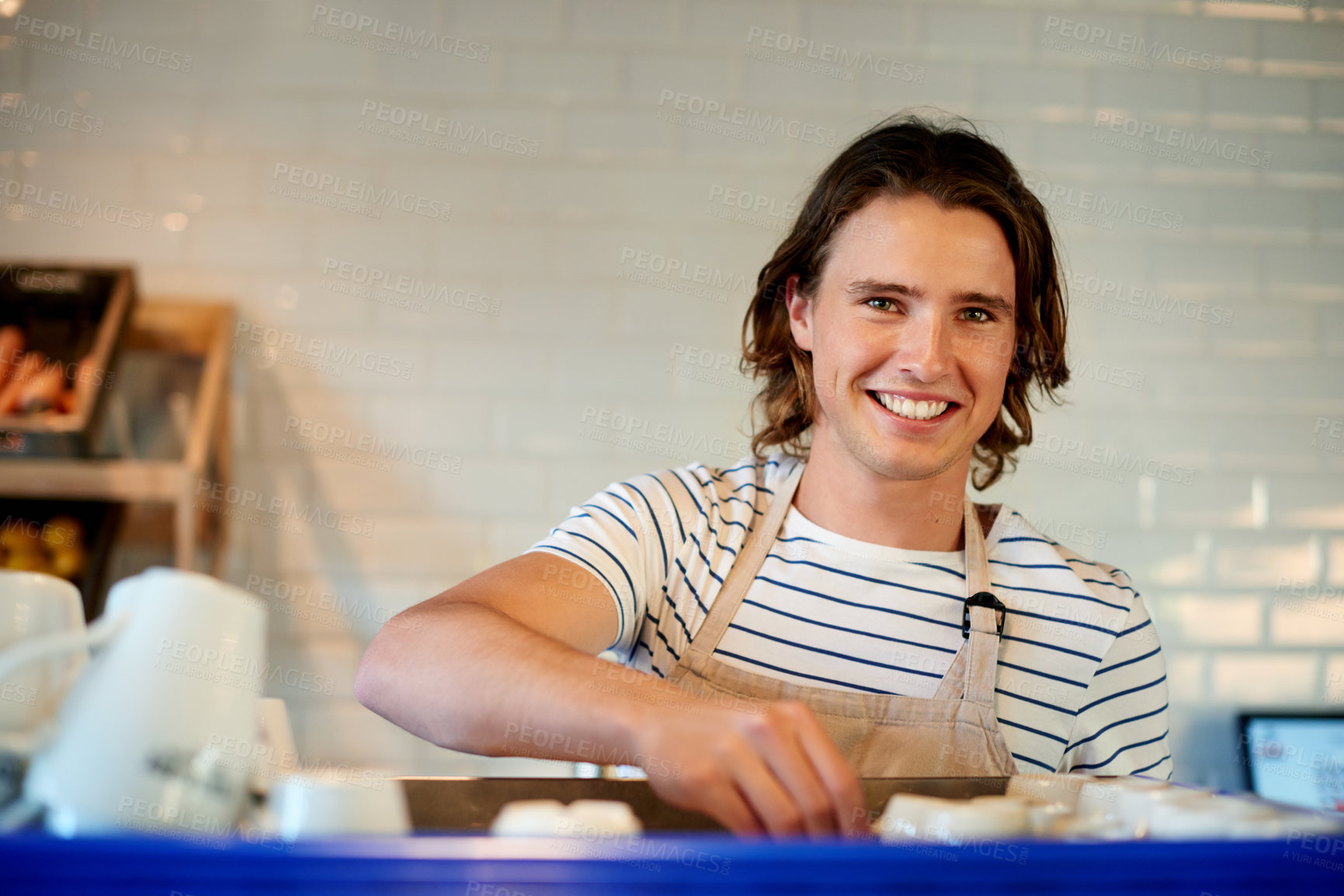 Buy stock photo Barista, happy and portrait of man in coffee shop for serving drinks, espresso and beverage. Restaurant, hospitality and person with cups for cappuccino, latte or tea for customer service in cafe