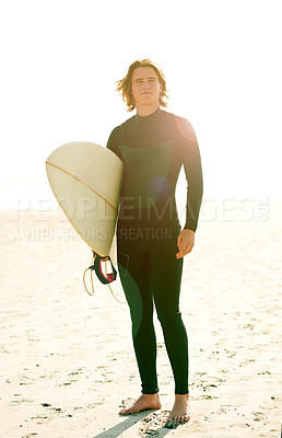 Buy stock photo Surfboard, water sports and man by beach for exercise, training or holiday activity for wellness. Sunset, swimsuit and male athlete by ocean for surfing, workout or fitness on tropical vacation.