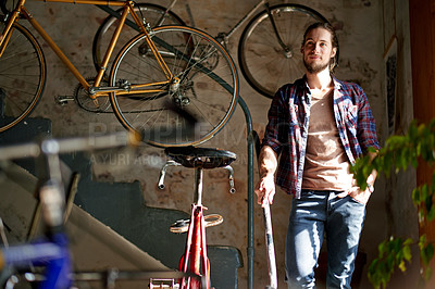 Buy stock photo Man, thinking and happy with bicycle, shop and reflection with small business owner in garage. Person, entrepreneur and mechanic for sustainable company, inspiration or bike restoration at workshop