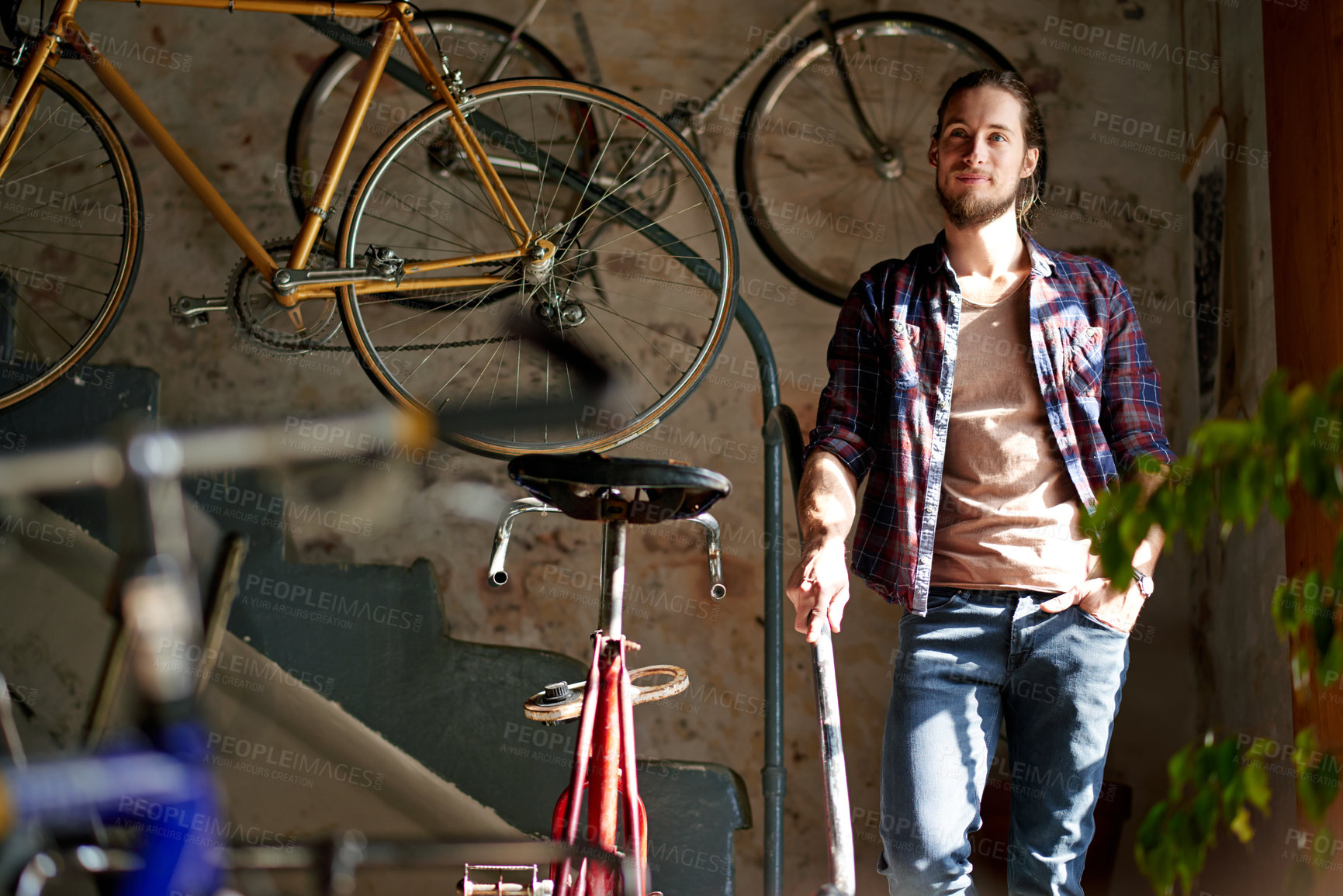 Buy stock photo Man, thinking and happy with bicycle, shop and reflection with small business owner in garage. Person, entrepreneur and mechanic for sustainable company, inspiration or bike restoration at workshop