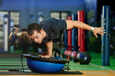 Buy stock photo Gym, balance or man with half ball in fitness for calisthenics practice, training or workout. Athletes, flexible or strong gymnast in club with stability trainer for athletics, acrobatics or exercise