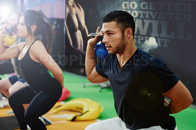 Buy stock photo Gym, group fitness and kettlebell for squat, power and sports challenge for muscle. People, bodybuilder and heavy weights for training with health club, workout class and personal trainer athlete