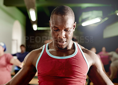 Buy stock photo Man, sweating and exercise in gym with fitness class for health, endurance training and coaching. Intense, challenge and person with group workout or instructor for physical activity at sports center