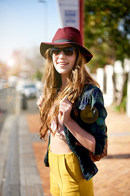 Buy stock photo Happy, girl and waiting at bus stop in city for travel shuttle, public transport and sightseeing abroad. Female teenager, relax and explore for taxi delay, morning commute and getaway trip on holiday