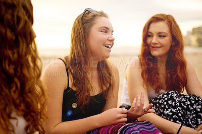 Buy stock photo Conversation, friends and girls at beach for holiday, travel and vacation for bonding together. Teenager, group and gen z people relax with smile, chat and ocean trip in Miami for summer adventure