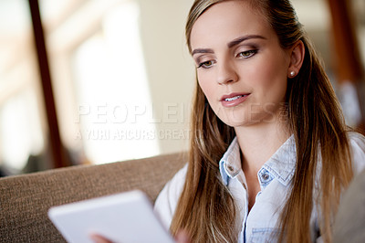 Buy stock photo Home, relax and woman on couch, tablet and online reading with ebook, social media and email. Apartment, technology and person on sofa, app and message to contact, chatting and communication