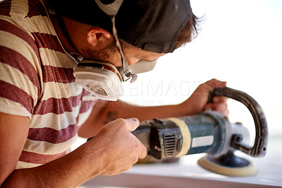 Buy stock photo Production, man and sanding surfboard in factory for manufacturing process, design and shape. Surf, workshop and person with electric tools to polish foam, creative craftsmanship and maintenance
