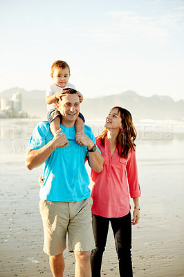 Buy stock photo Walking, parents and baby on shoulder at beach for travel adventure, holiday break or bonding. Happy family, support and dad carry child on seashore for weekend trip, vacation getaway or mockup space