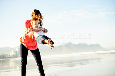 Buy stock photo Swinging, beach and mother with boy, vacation and bonding together with space. Ocean, family or parent with child, playing or mama with adventure, tourism or summer holiday with break in Zanzibar