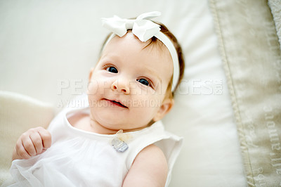 Buy stock photo Content, face and infant resting in family home, peaceful morning and waking up happy in nursery room. Above, healthy and calm child with smile for early childhood development, relax and awake.