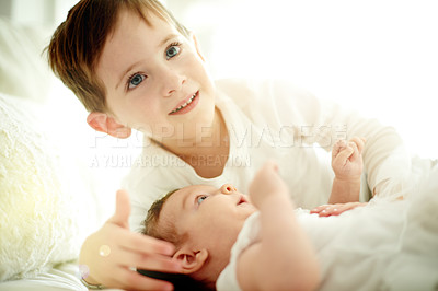 Buy stock photo Boy, child and relax with baby for sibling love, weekend or childhood development in home. Happy kid, toddler and generation with brother or smile for comfort, trust or support together in house