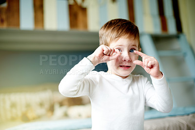 Buy stock photo Expression, kid and boy in bedroom, portrait and home with imagination, creativity and playing. Relax, child development and fun with weekend break, apartment and growth with fantasy and game