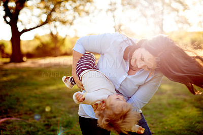 Buy stock photo Smile, mother and daughter playing in park for bonding, outdoor space and family time for happiness. Love, playful relationship and woman with child outside together, care and support for summer fun.