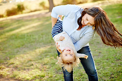 Buy stock photo Love, mother and daughter playing in park for bonding, outdoor space and family time for happiness. Weekend, playful relationship and woman with child outside together, care or support for summer fun