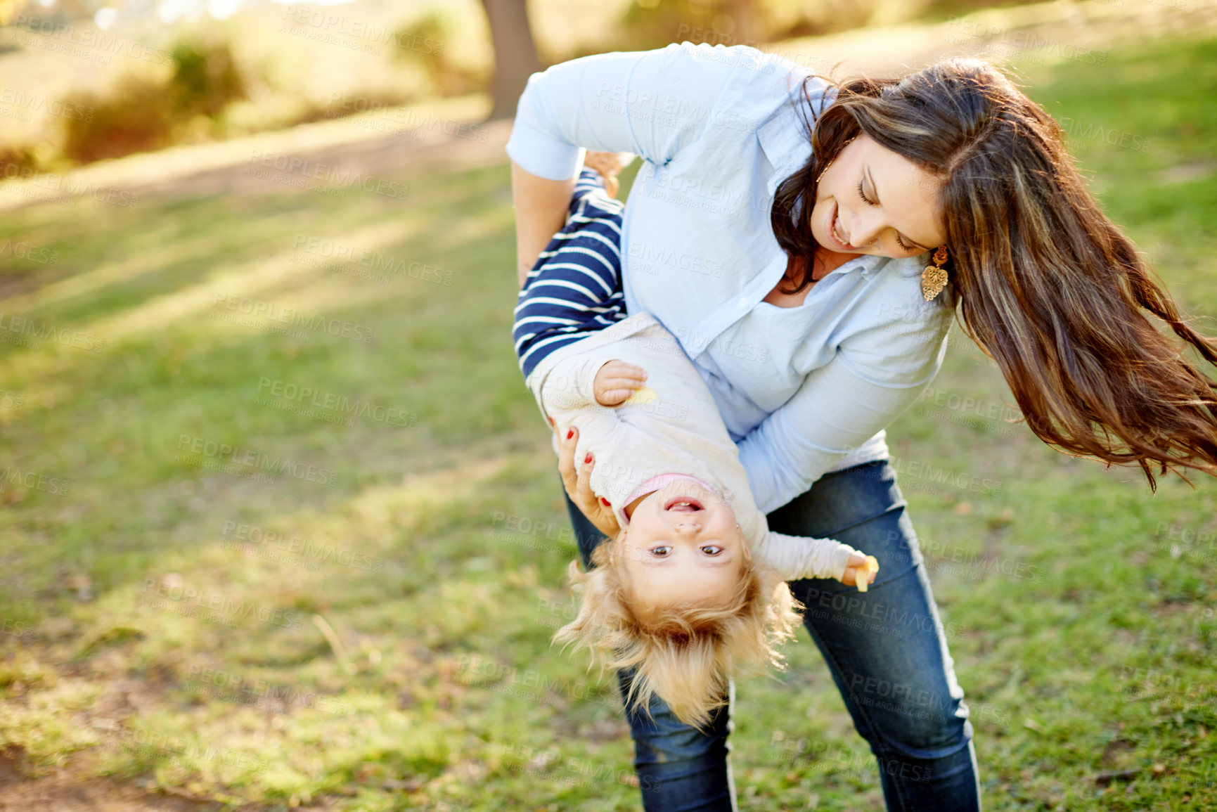 Buy stock photo Love, mother and daughter playing in park for bonding, outdoor space and family time for happiness. Weekend, playful relationship and woman with child outside together, care or support for summer fun