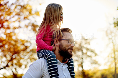 Buy stock photo Happy, father and child on shoulder at park for travel, playful fun and bonding together on holiday. Smile, man and carry toddler with love, balance support and vacation with games to explore nature