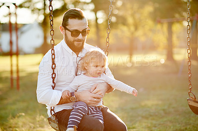 Buy stock photo Morning, swing and dad with child in park for playing, fun and bonding on weekend in nature. Happy, family and father with girl on playground for relationship, activity and adventure together outdoor