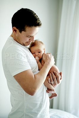 Buy stock photo Home, childcare and dad with baby, care or first time parent with love for newborn, safe or comfort. Family, together and man with child in nursery, protection and father with affection or bonding