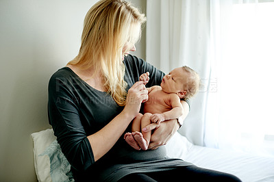 Buy stock photo Happy, mom and playing with baby, home and bonding with newborn, love and affection in nursery room. Family, woman and smile for infant, together and game with daughter, childcare and fun in house