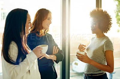 Buy stock photo Women, coffee break and friends in startup for talking, collaboration or gossip in workplace. Chat, happy and people in conversation together with team for drinking espresso, latte or tea beverage
