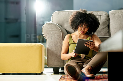 Buy stock photo Woman, fashion designer and research with tablet in home for online course, styling tips or network. Female person, user or scrolling with technology for clothing trend or app on floor in house