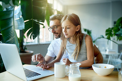 Buy stock photo Dad, laptop and teaching in home for child, tech and internet safety with breakfast. Thinking, scroll and learning with man, father and girl together for online education, knowledge or conversation